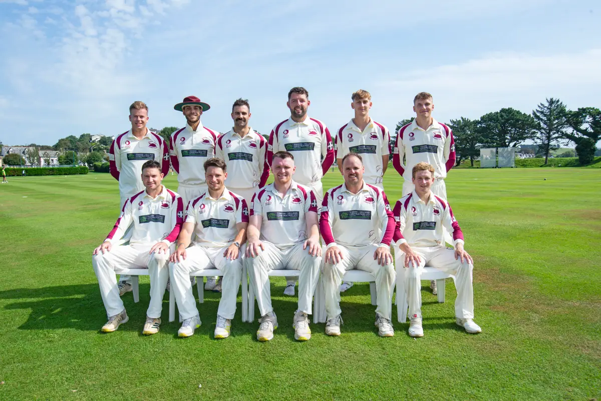 The Wadebridge 1st XI team photo, September 2023: two rows of players in whites with claret trim on the outfield.